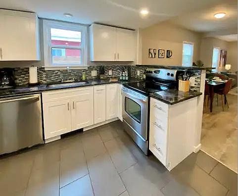 Beautiful, updated kitchen supplied with plates, cups, silverware, pots & pans, etc.