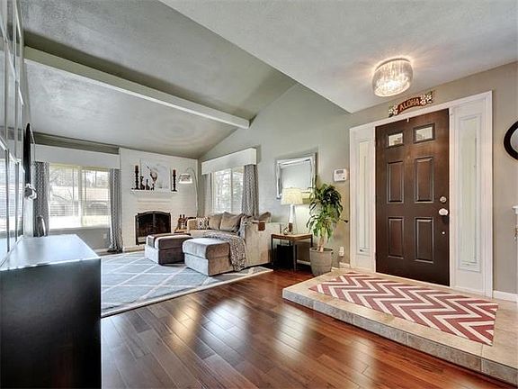 The front door welcomes you inside this warm and inviting  home.