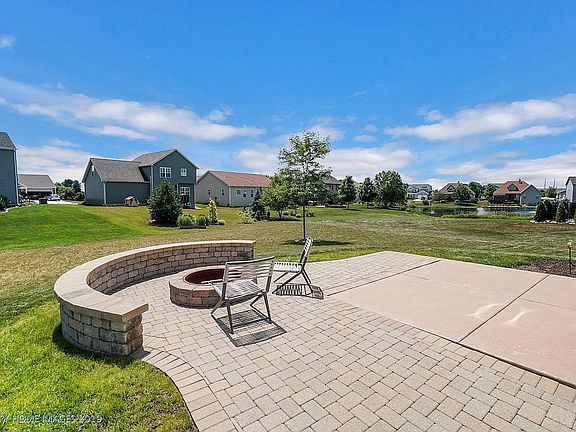 AMAZING stone patio with fire pit.