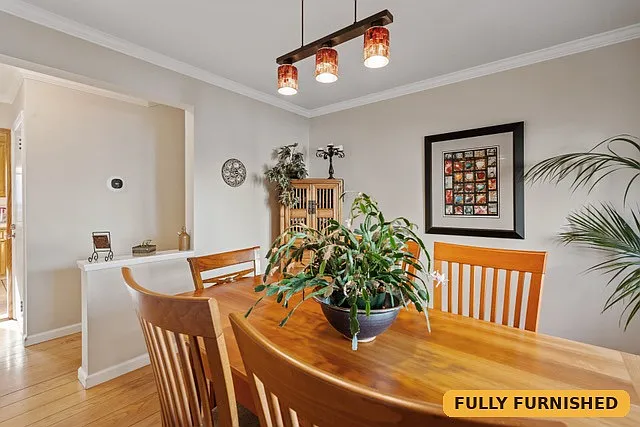 Formal dining room seats six.