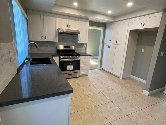 Brand new kitchen cabinets, custom pantry with pull outs. Brand new stove, oven, dishwasher and range hood.