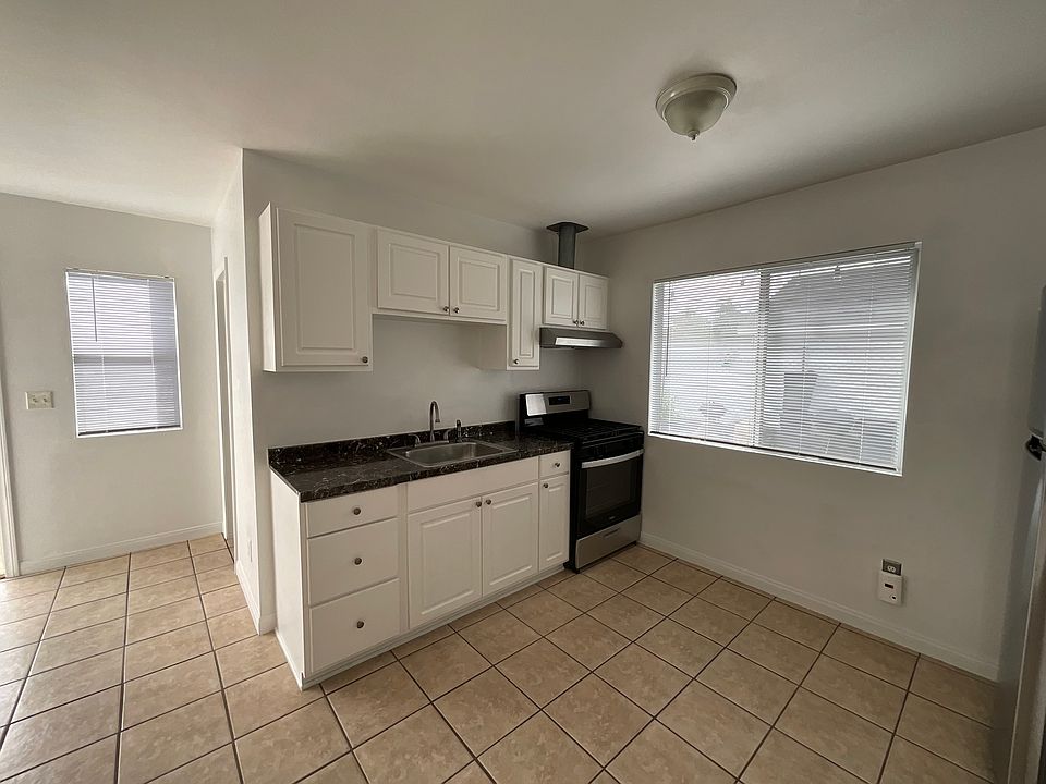 Kitchen has plenty of cupboards stove provided