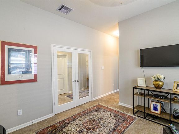 Down the hallway and to the left is your Flex Room, currently used as a office.