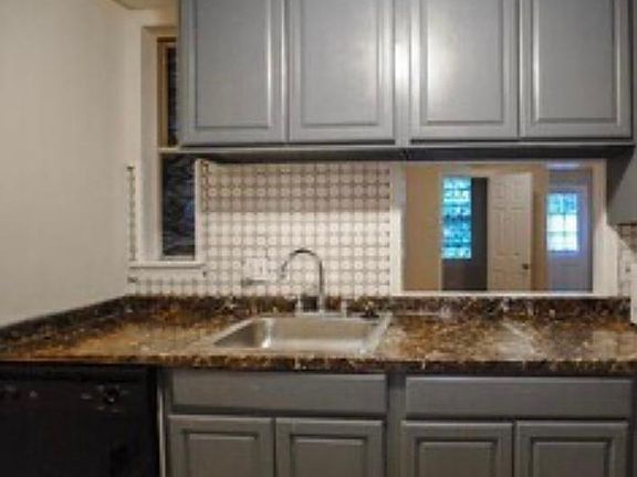 Pass the living room is the kitchen, with new flooring, new refrigerator, diswasher, and garbage disposal

Enjoy cooking while engaging with guest in dining room with a kitchen pass-through