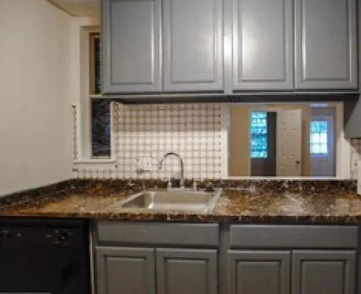 Pass the living room is the kitchen, with new flooring, new refrigerator, diswasher, and garbage disposal

Enjoy cooking while engaging with guest in dining room with a kitchen pass-through
