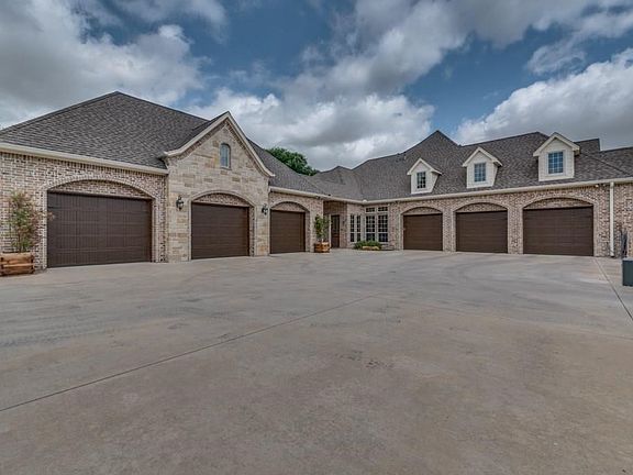 Private gated motor court, 7 car garage (3 attached plus 4 detached).  Detached could be converted to separate guest quarters - see sketch attached in documents section.