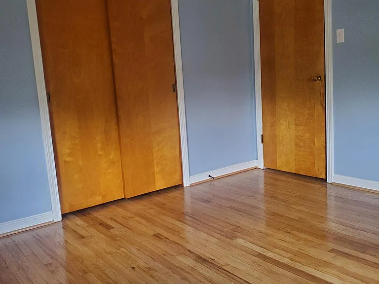 The back bedroom size is 11.5 by 11.5 ft.