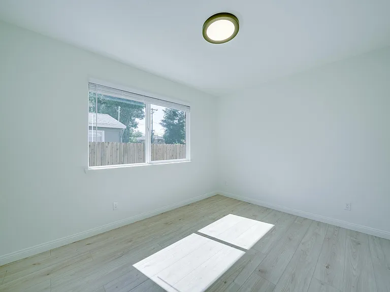 3rd bedroom. New paint, blinds, flooring, light fixtures.