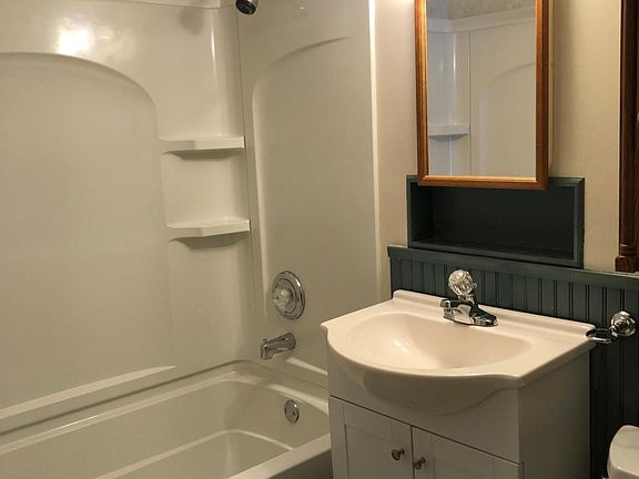 Full bath with tub and shower.