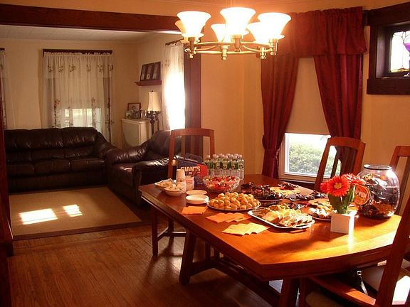 Formal dining room with hardwood floors and open to the living room.