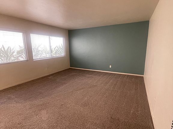 Spacious living room with accent wall. Accent wall paint can be changed.