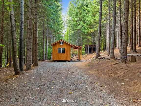 This property is ready for you to come and enjoy.  This cabin is surrounded by evergreens, an immaculate forest floor and large area to explore and make your own.