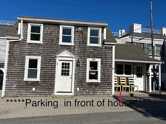 The windows have new white blinds on them, but they are pulled up in this photo to allow the warm, fall sun to stream in to warm the house.