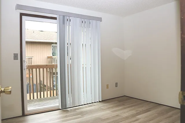 Large South Bedroom looking at South-facing balcony