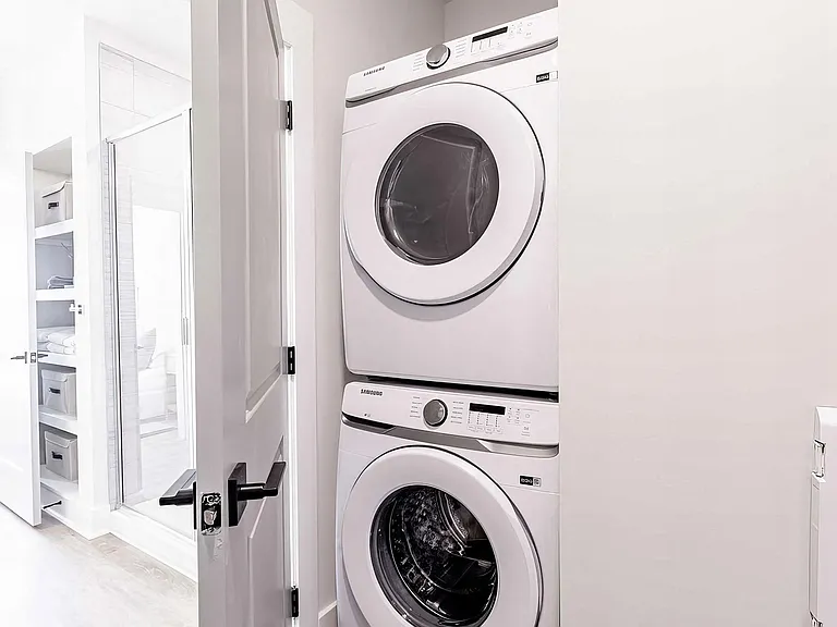 Modern bathroom with convenient in-unit washer and dryer