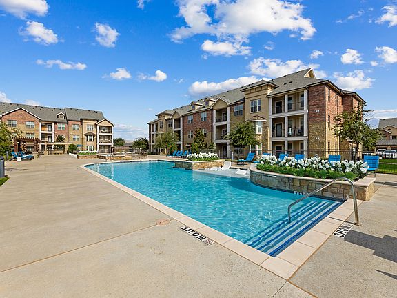 Relax poolside at Auberge of Burleson where luxury living meets small-town charm.