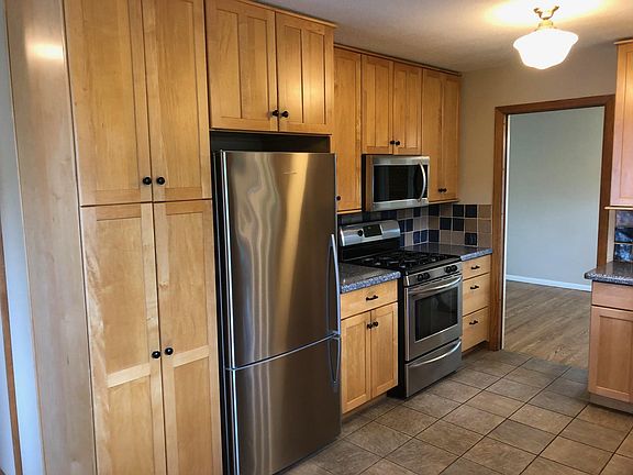Kitchen showing pantry cupboards, stainless Fisher Paykal re