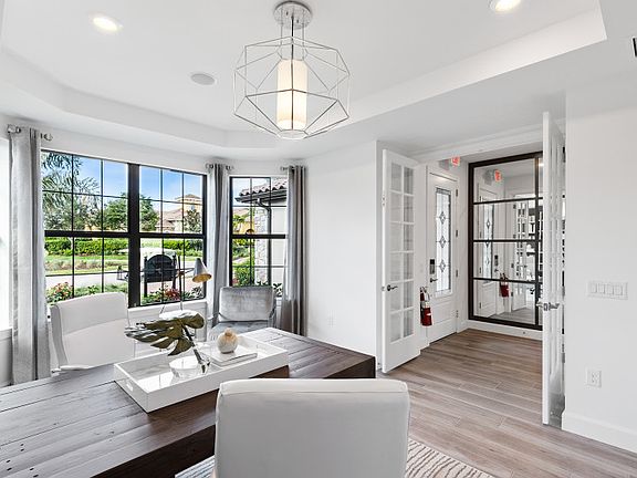 Enclosed flex space with bright window, perfect space for a home office or hobby room