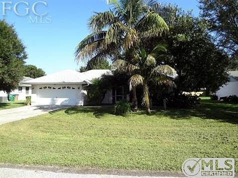 Large Family Room with soaring ceiling & new carpet.