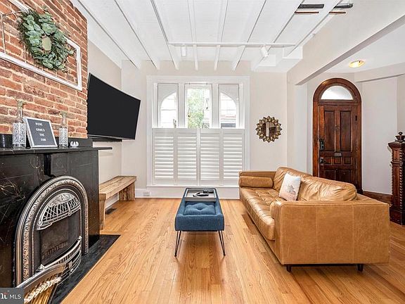 Living Room with exposed brick & gas fireplace