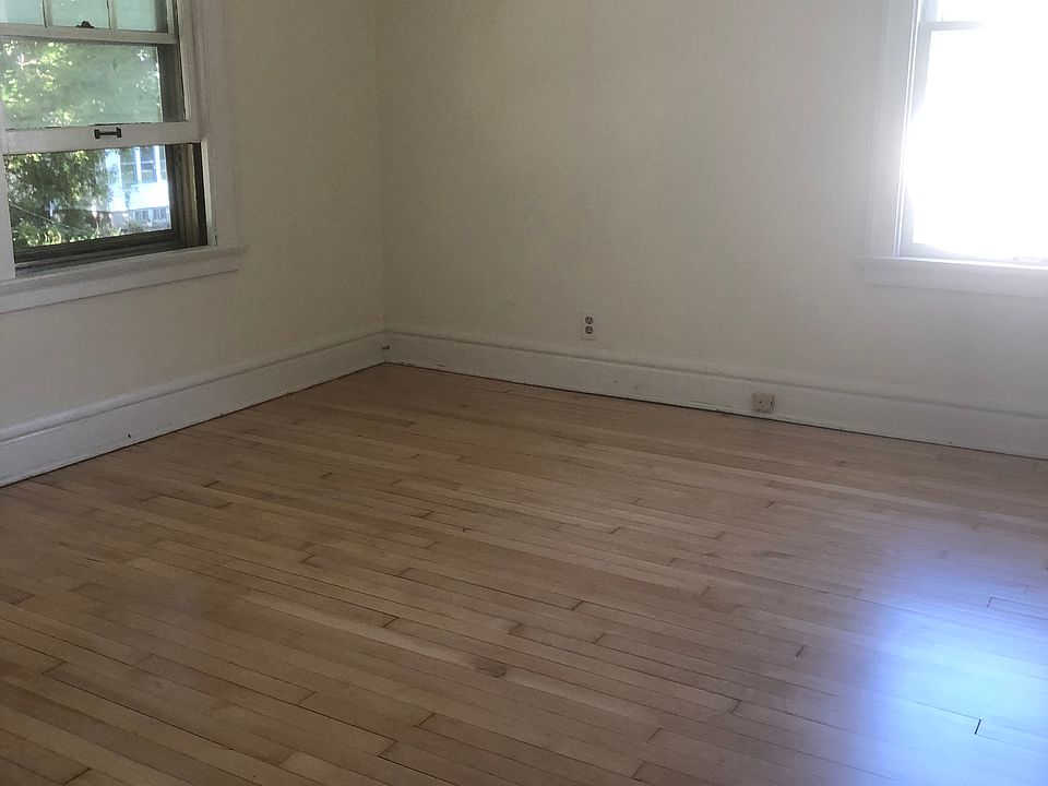 Newly refinished hardwood floor in living room.