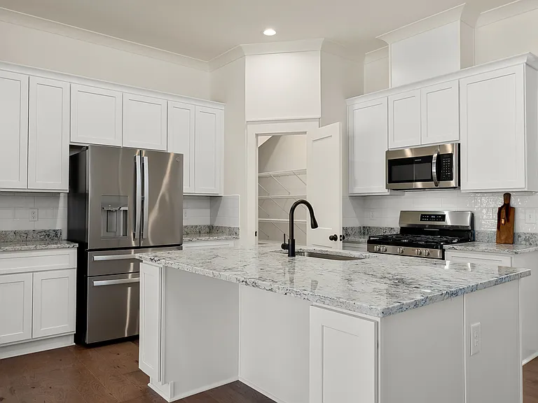 The pantry is a walk-in and loaded with plenty of shelving to storage many items of your choice.