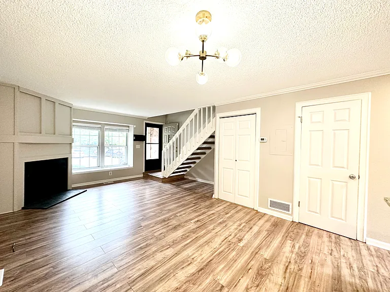 Wood burning fireplace and light bright living area