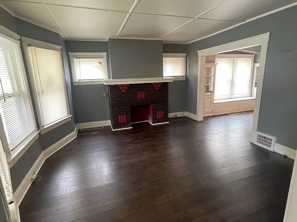 Living room area wood floors and new windows