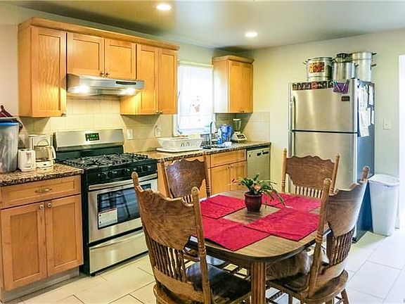 Large eat-in kitchen on first floor with new ss appliances