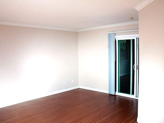 View of Living Room and Outdoor Patio from Kitchen