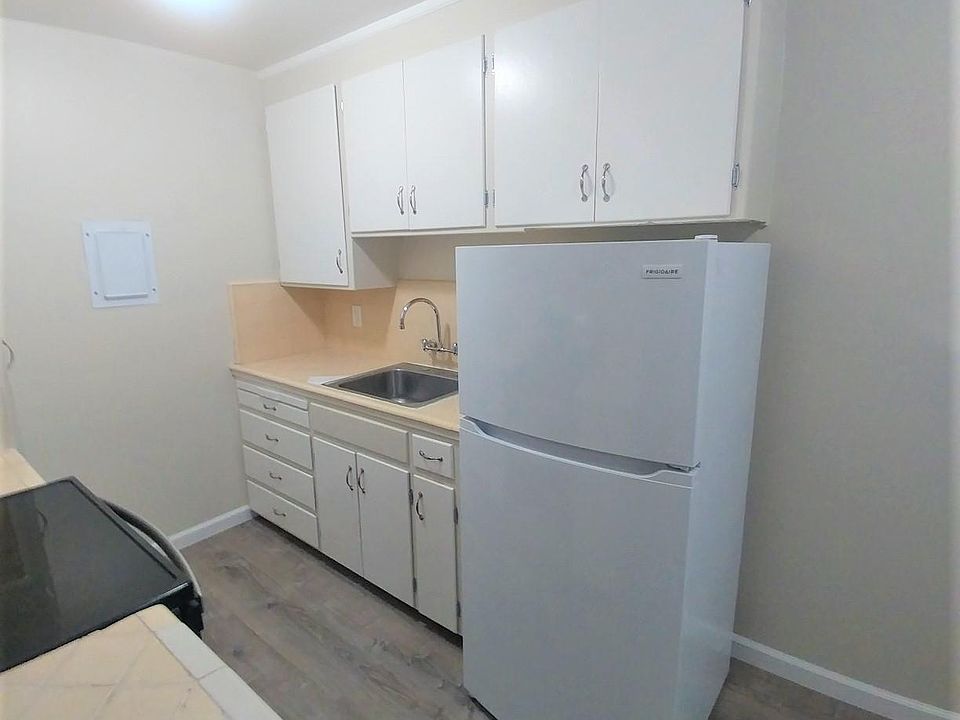 Kitchen with a new fridge.