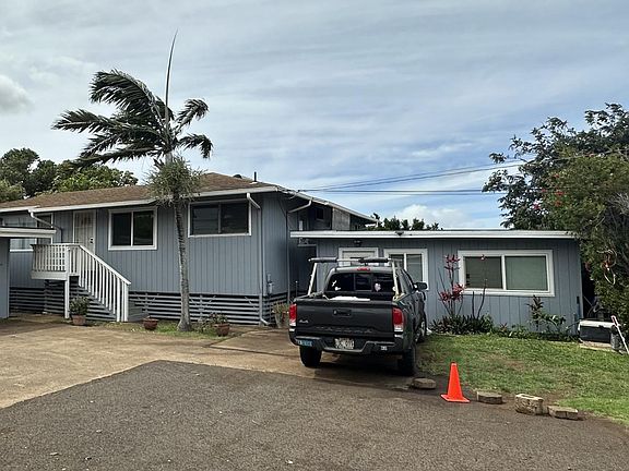 Main Home front entrance with two car garage dedicated to home. Ohana unit to the right is detached with a quiet long term tenant.