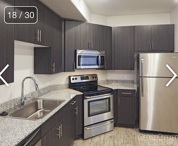 Bamboo cabinets, Stainless steel handles, white laminate ins
