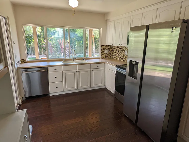 Next, enter the kitchen, dining room and family combo with access to the cover patio wire for a outdoor home theater