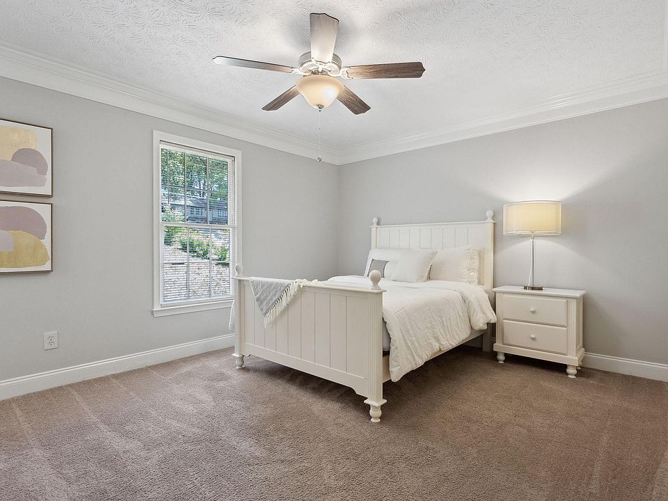 Room #4 with a queen bed, art and a dresser.