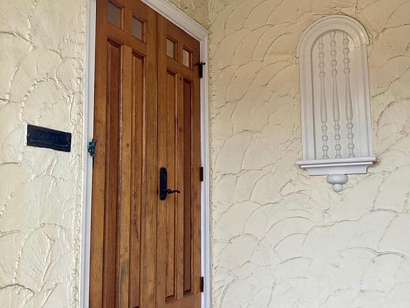 Solid custom designed Spanish cedar double doors.