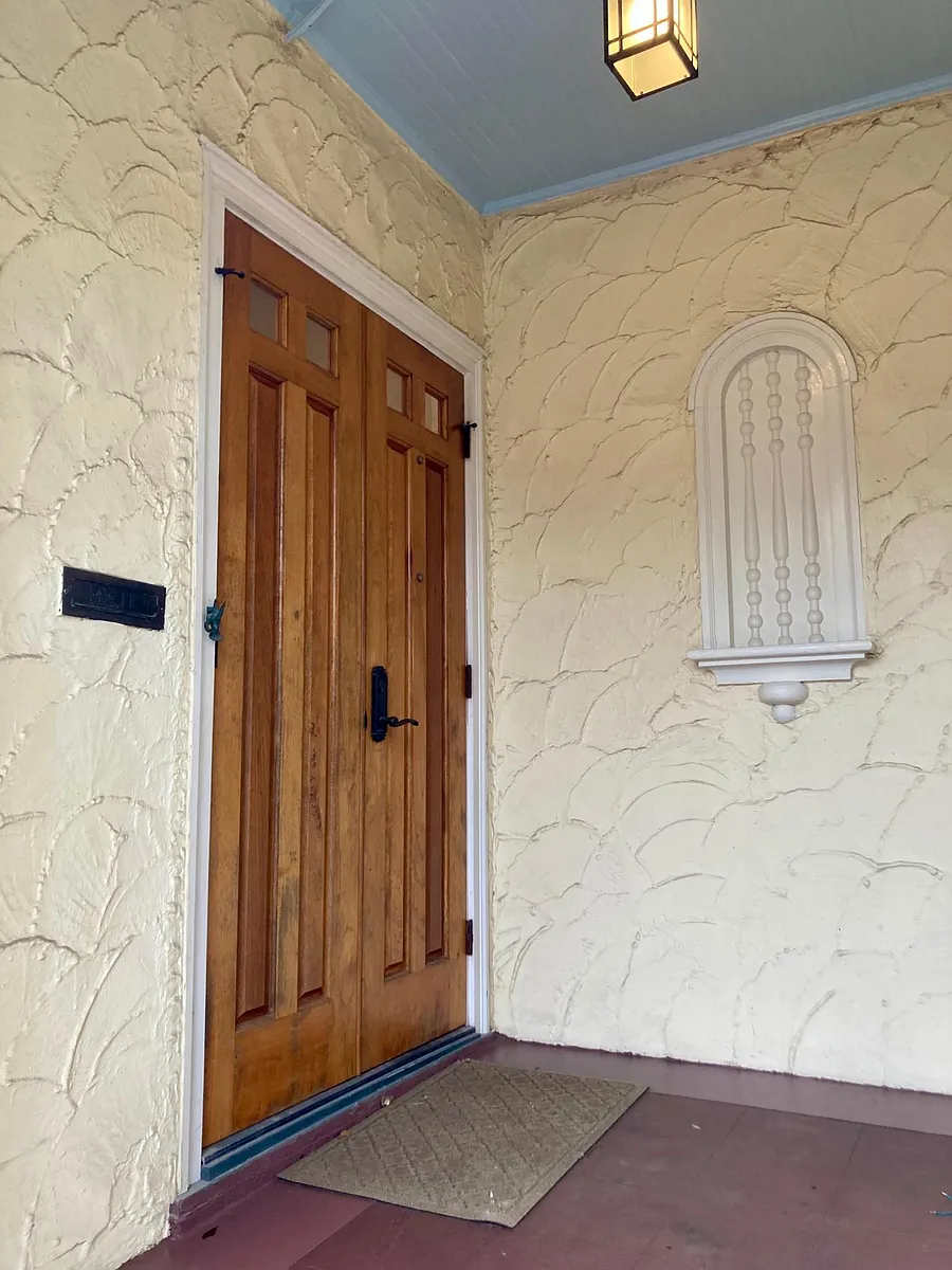Solid custom designed Spanish cedar double doors. - 3814 State Street Dr