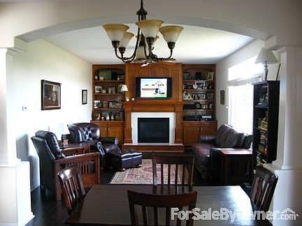 Family Room : HDTV wired above gas fireplace. Bookshelves wired for speakers.