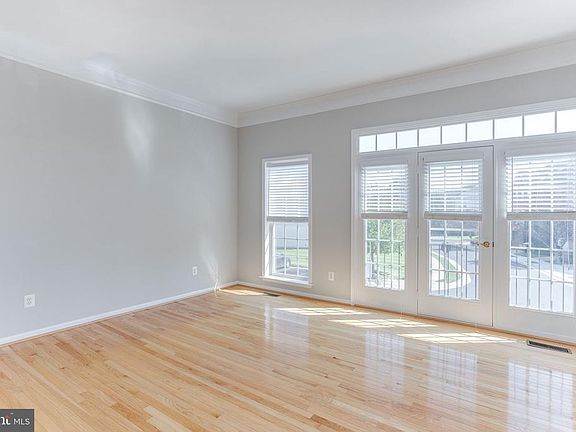 Sunny Living Room with Floor to Ceiling Windows
