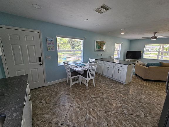 , dinette set expands when needed. Back door.