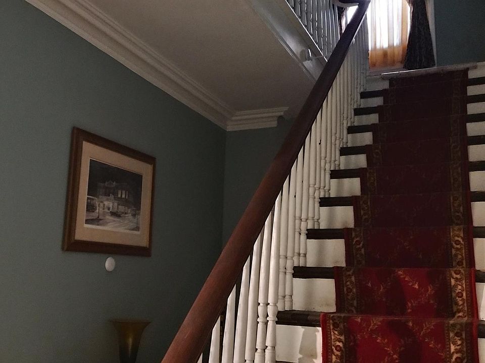 Main hallway. Stairway to second floor