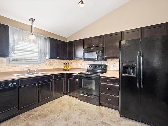 There is pride of ownership in this home! Lots of counter space in the kitchen, back splash, upgraded custom lighting.