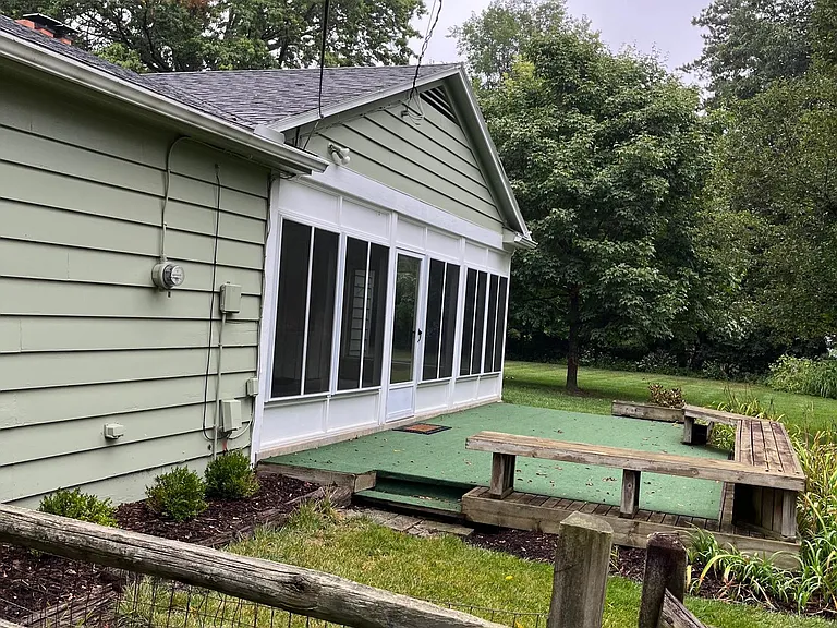 side yard w/ sunroom