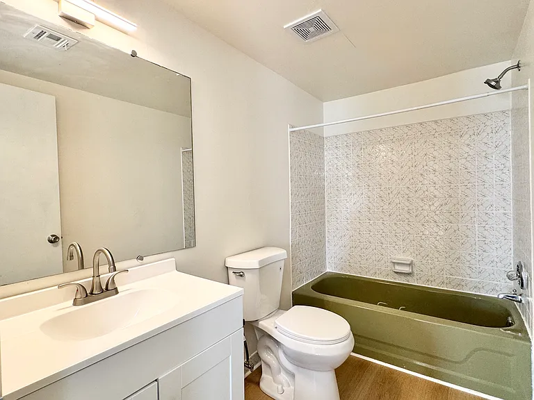 UpdateUpdated hall bath with new vanity, new toilet, and new light fixtured hall bath