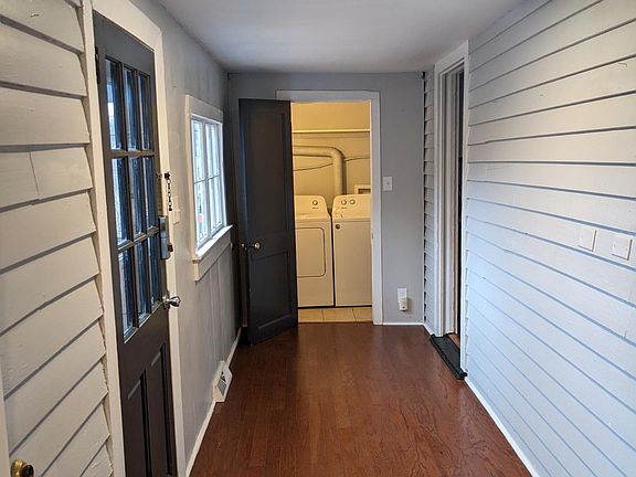 entry from deck, laundry room at end, doors into kitchen and living give great circulation