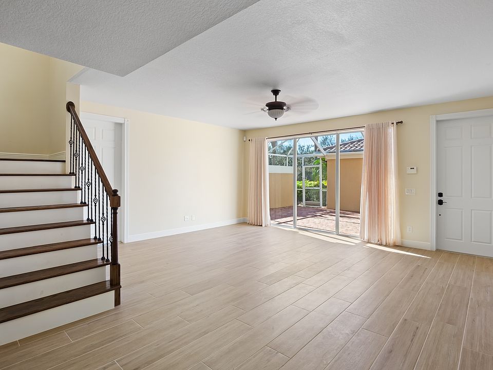 Great room with sliders leading to screened in lanai