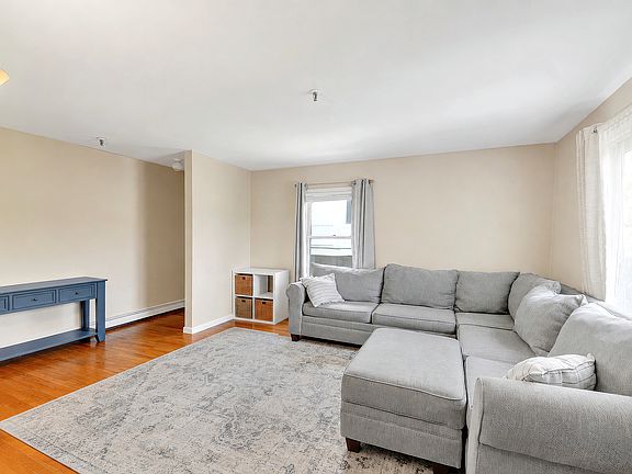Large living room with double exposure and hardwood floors
