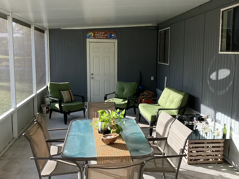 Screened in porch with washer and dryer room!