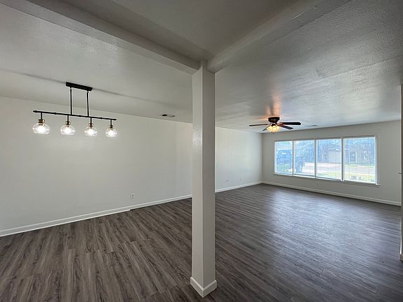 Looking back at street view; dining space and living room