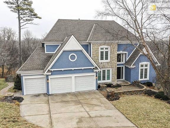 Spacious 1 1/2 Story backing to woods.